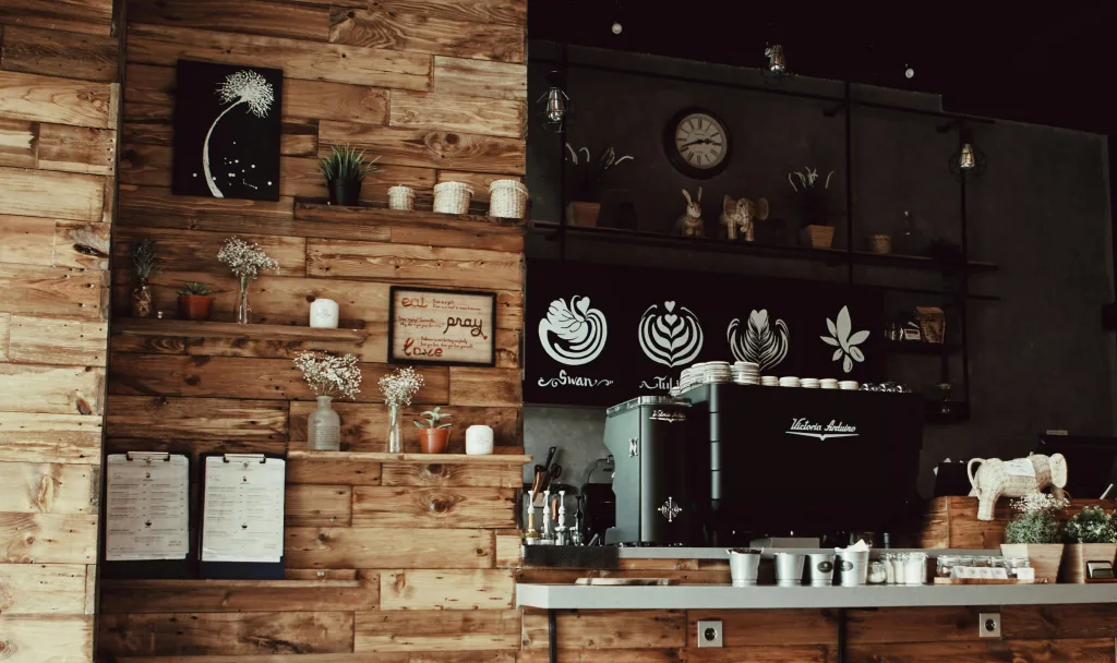 A café wall with coffee art and wooden panels